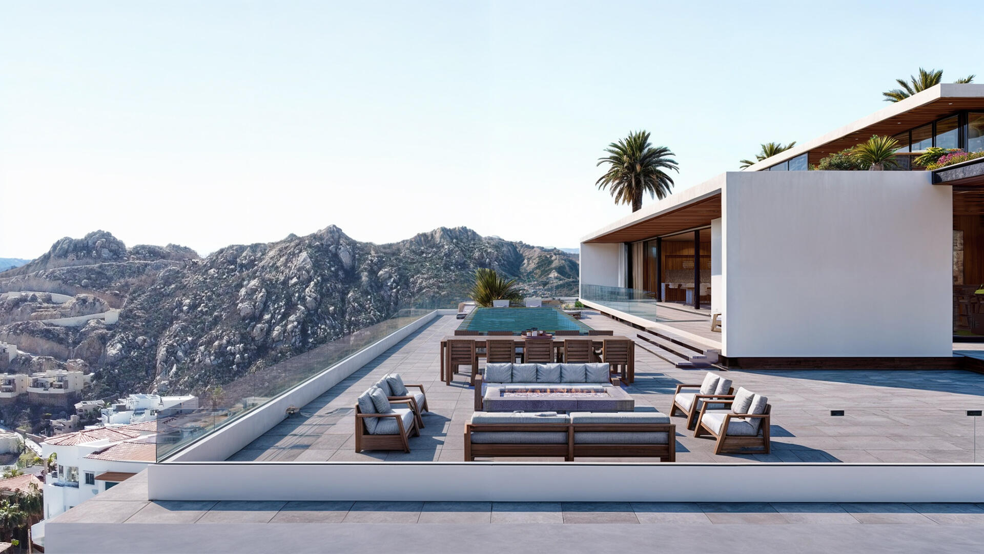 Villa del León terrace by day in Pedregal — fire pit, dining, pool, mountain view